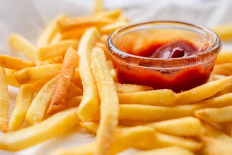 Golden seasoned fries with dipping sauce