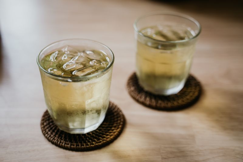 Assorted soft drinks in glasses with ice